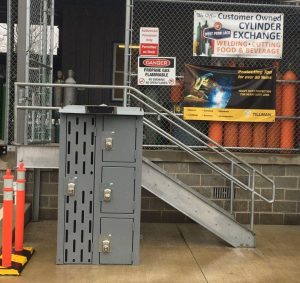 steel lockers for pick up orders in front of cylinder storage.